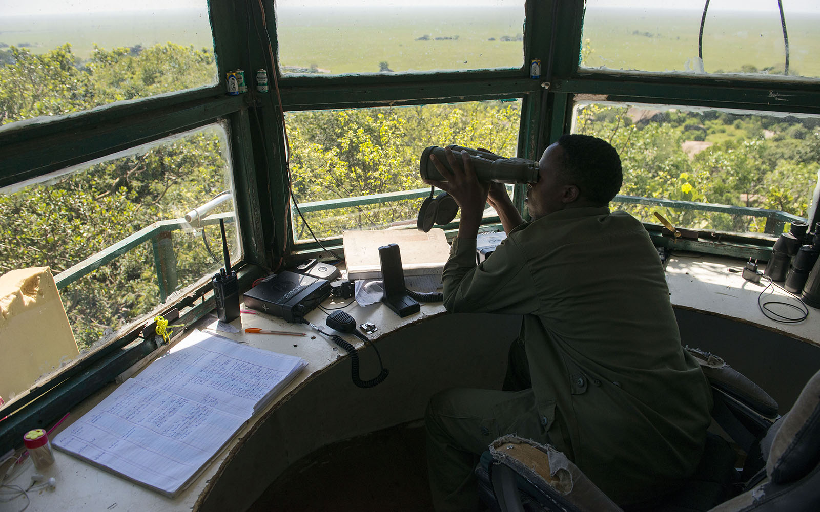 A Moru rhino Ranger scanning and searching for rhinos from a special tower. He is also searching for poachers. Moru, Serengeti, Tanzania. © Daniel Rosengren